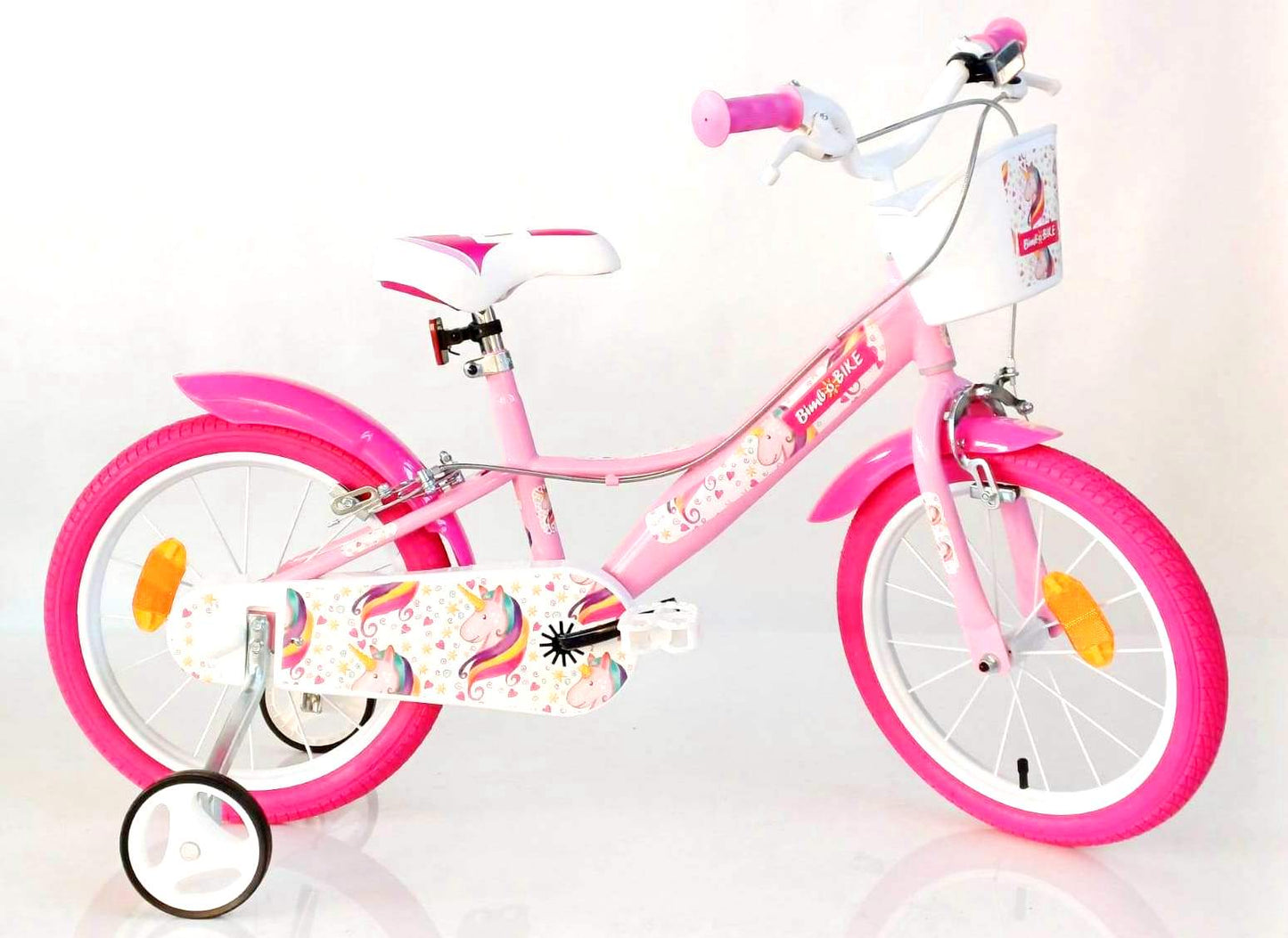 Bicicletă pentru fete 16" Bottari Unicorn roz și alb, cu 1 viteză, pentru copii, poziționată pe o suprafață de asfalt.