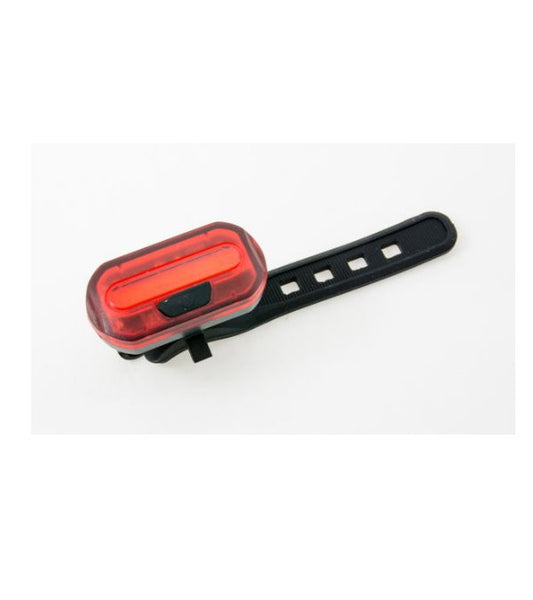 Red LED bicycle rear light from Bottari, mounted on bike to enhance visibility and safety during rides.