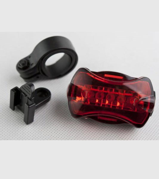 Bottari Lumina spate bicicleta HERO 5LED with 7 modes, mounted on a bicycle, showcasing compact rear bike light.